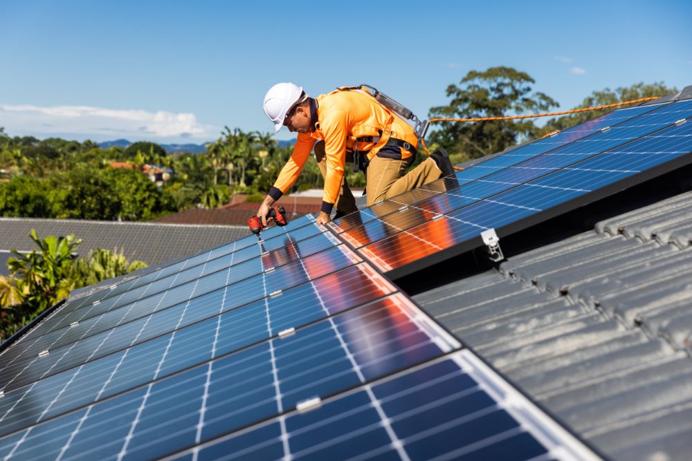 Aztech Solar technician installing solar panels on a residential rooftop on the Central Coast NSW