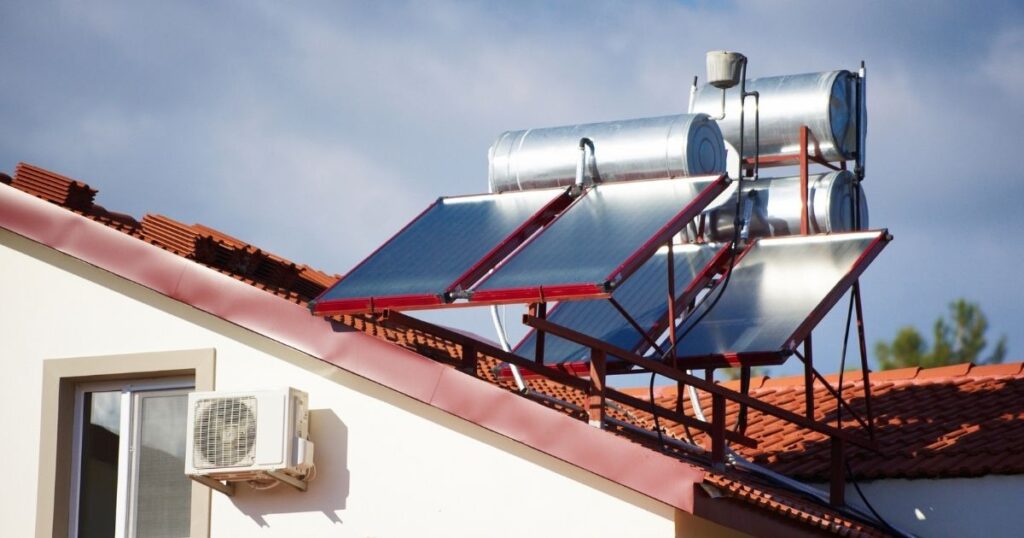 Solar hot water system installed on tiled rooftop