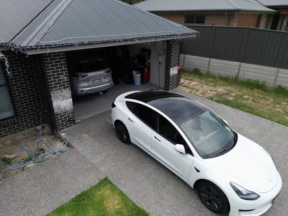 An electric car in a Hunter driveway