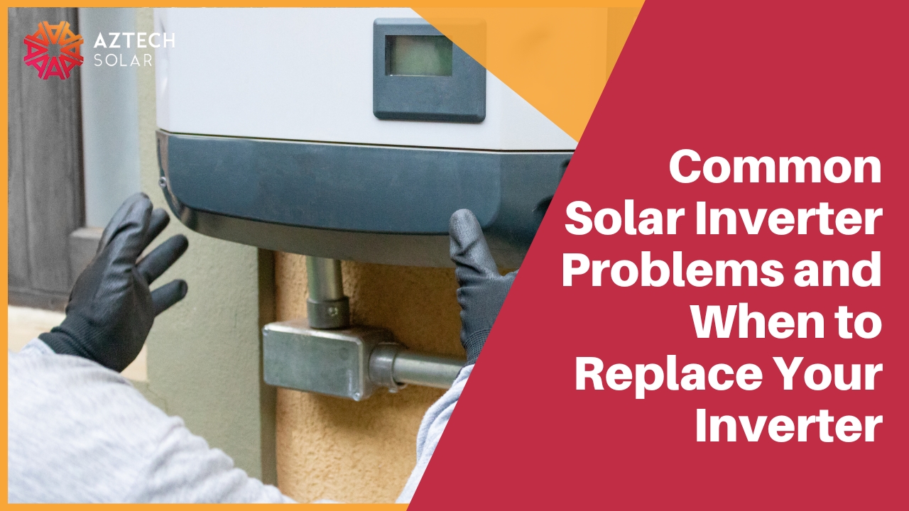 A technician wearing black work gloves inspects a white solar inverter unit mounted on an outdoor wall.